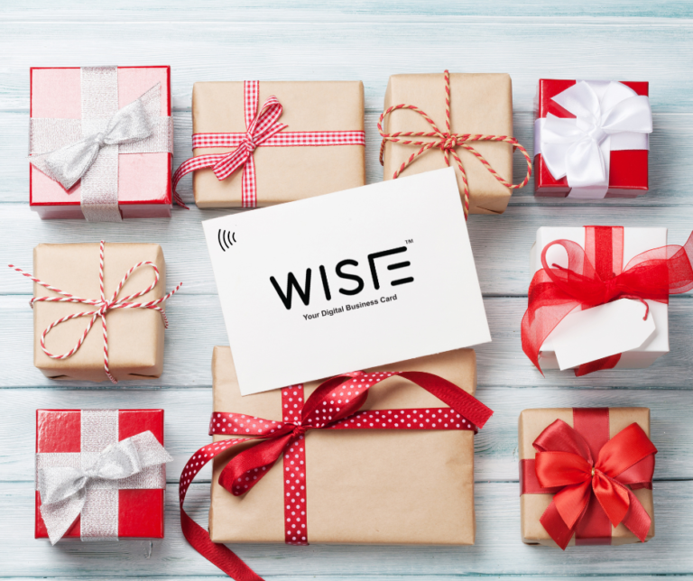 gift boxes and a card on top of them writing: wisie, your digital business card.